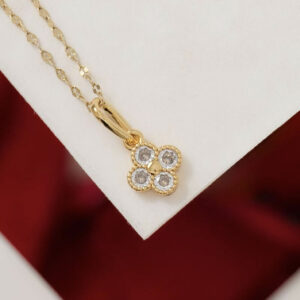 Gold clover charm